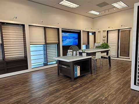 Store interior showcasing several different types of window coverings